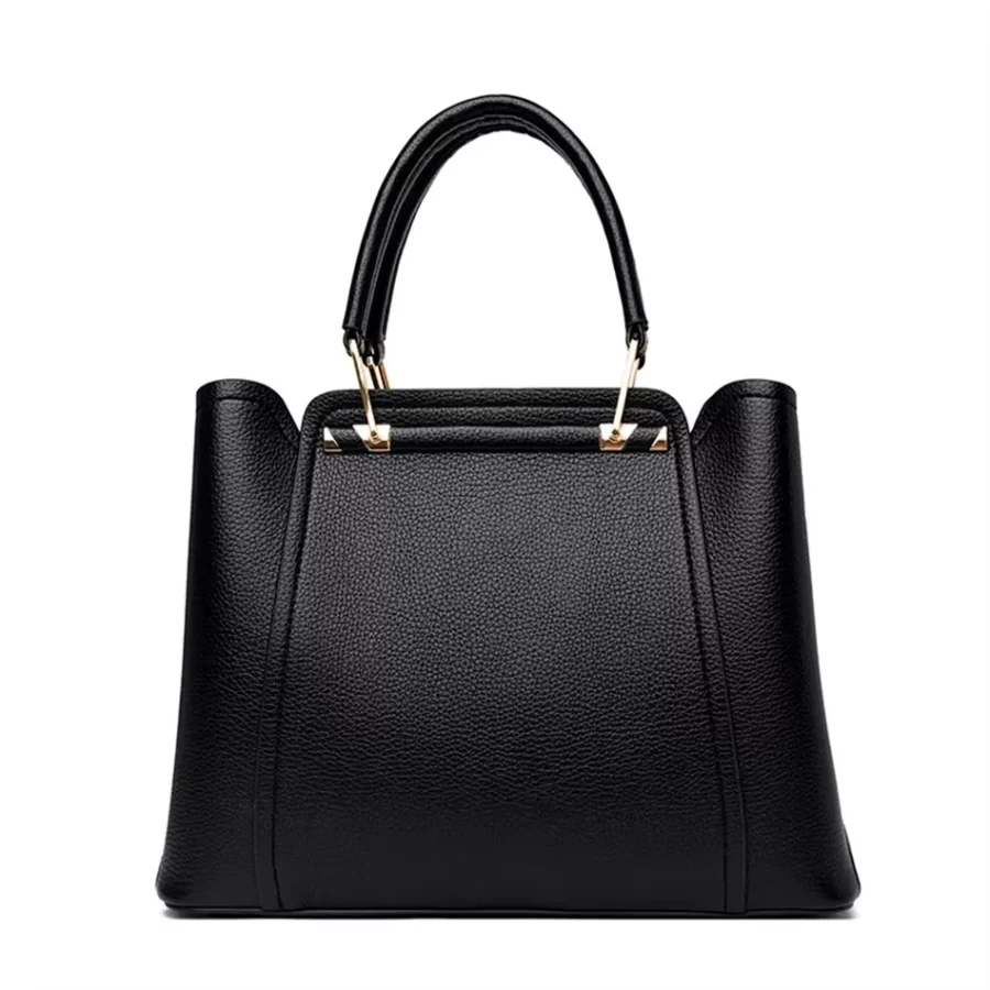 Svart PU-läder handväska för dam med dubbelhandtag. Minimalistisk design, perfekt för en chic och modern look i alla tillfällen.