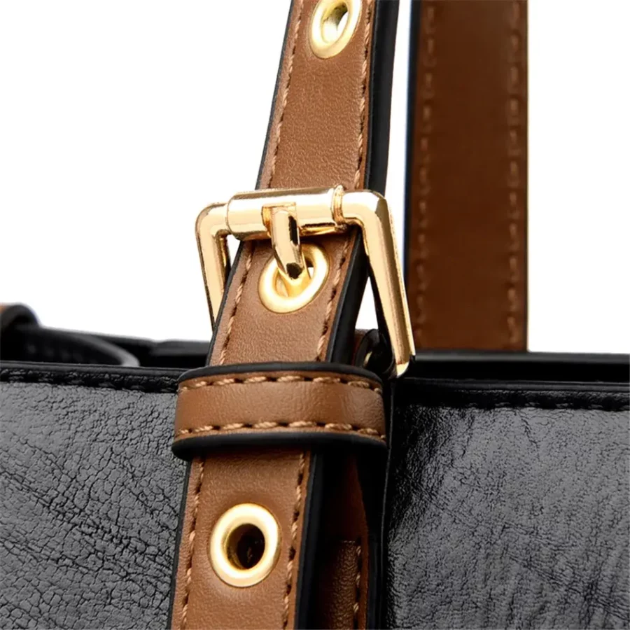 Stilren svart vintage handväska för dam. Praktisk och elegant design för både arbete och fritid.