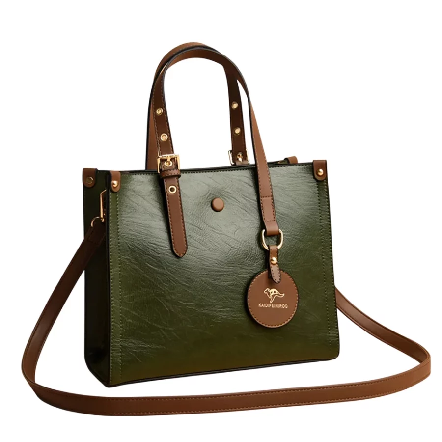 Grön axelremsväska i läder med bruna handtag, elegant modell för dam.